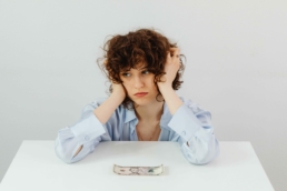 Stressed woman using equipment rental software