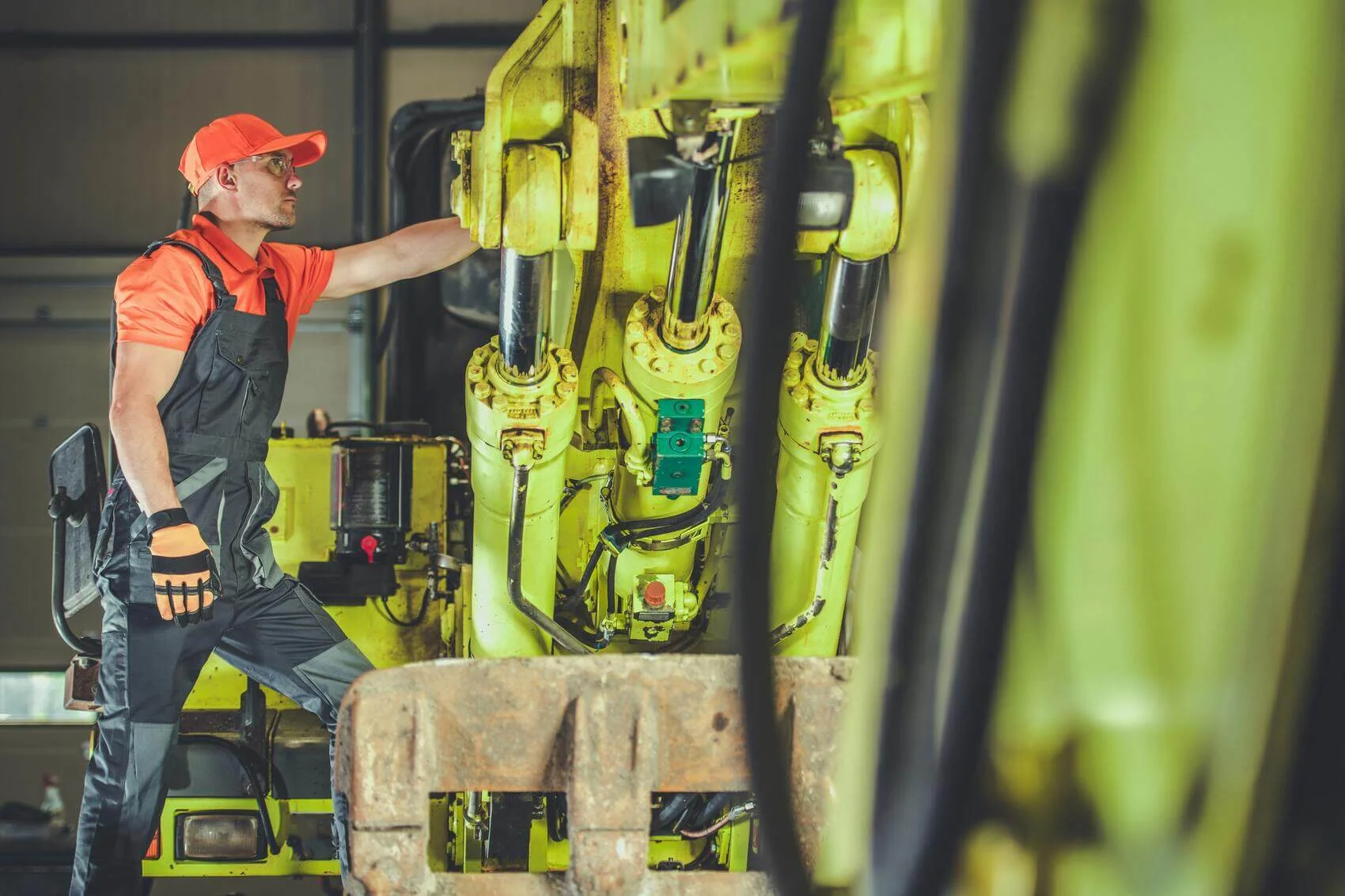 Worker Maintaining Heavy Equipment